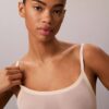 Body minimalista in rete a metà coscia Body minimalista in rete a metà coscia