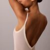 Body minimalista in rete a metà coscia Body minimalista in rete a metà coscia