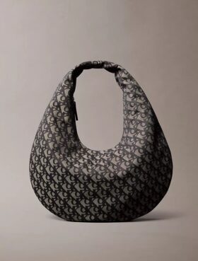 Borsa a tracolla con motivo Monogram a mezzaluna