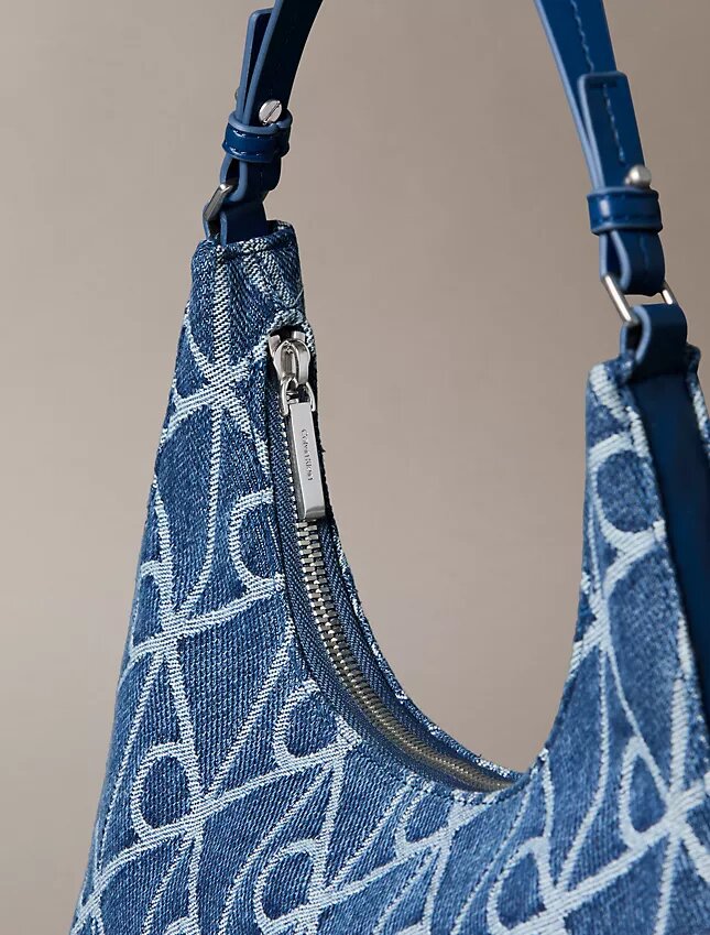 Borsa a tracolla in Denim con logo su tutta la superficie Borsa a tracolla in Denim con logo su tutta la superficie