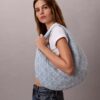 Borsa Hobo in Denim con logo emblema su tutta la superficie Borsa Hobo in Denim con logo emblema su tutta la superficie