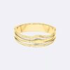Bracciale rigido con forma fluida e scultorea