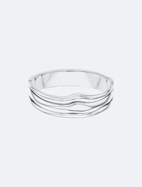 Bracciale rigido con forma fluida e scultorea