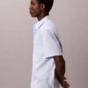 Camicia button-down a maniche corte in cotone elasticizzato a righe Camicia button-down a maniche corte in cotone elasticizzato a righe