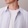 Camicia classica elasticizzata a righe tinte in filo Camicia classica elasticizzata a righe tinte in filo