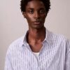 Camicia comoda a righe in cotone con bottoni Camicia comoda a righe in cotone con bottoni