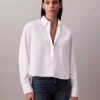Camicia corta squadrata con bottoni Camicia corta squadrata con bottoni