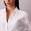 Camicia corta squadrata con bottoni Camicia corta squadrata con bottoni