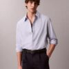 Camicia in cotone tinta unita dal taglio morbido con colletto button-down Camicia in cotone tinta unita dal taglio morbido con colletto button-down