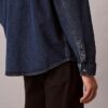Camicia oversize in Denim con Monogram su tutta la superficie in stile anni ’90 Camicia oversize in Denim con Monogram su tutta la superficie in stile anni ’90