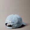 Cappellino da baseball con logo emblema su tutta la superficie in Denim