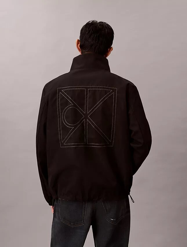 Giacca reversibile con logo su tutta la superficie Giacca reversibile con logo su tutta la superficie