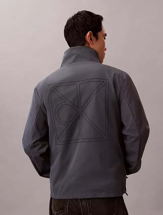 Giacca reversibile con logo su tutta la superficie Giacca reversibile con logo su tutta la superficie