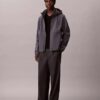 Giacca softshell con cappuccio e zip Giacca softshell con cappuccio e zip