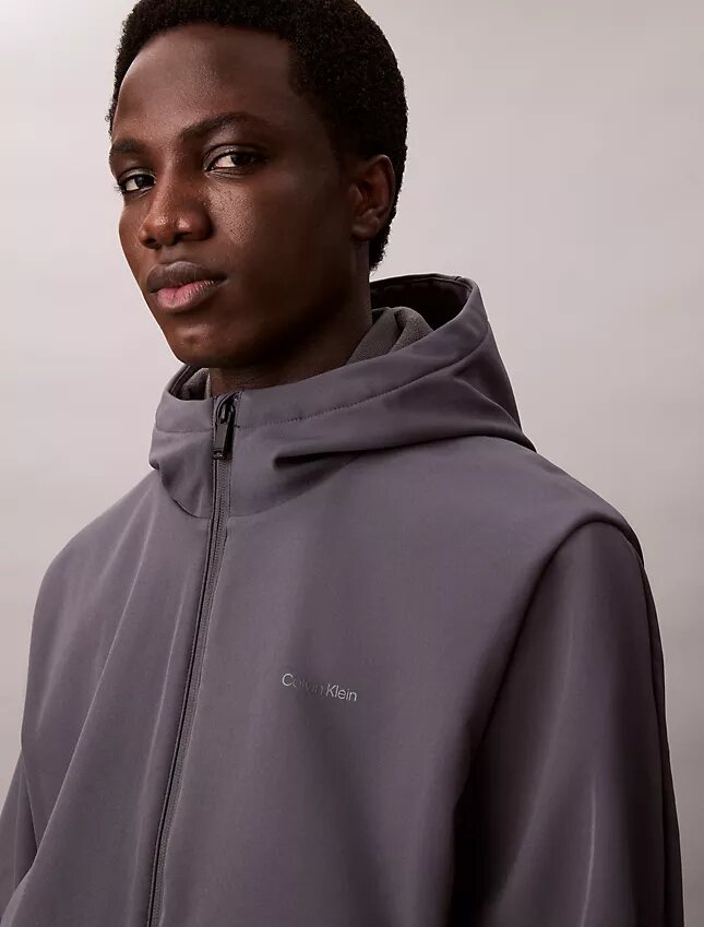 Giacca softshell con cappuccio e zip Giacca softshell con cappuccio e zip