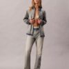Jeans bootcut morbidi con cimosa