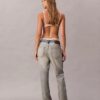 Jeans bootcut morbidi con cimosa