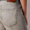 Jeans bootcut morbidi con cimosa