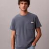 Maglietta comoda con tasca in jersey di cotone Maglietta comoda con tasca in jersey di cotone