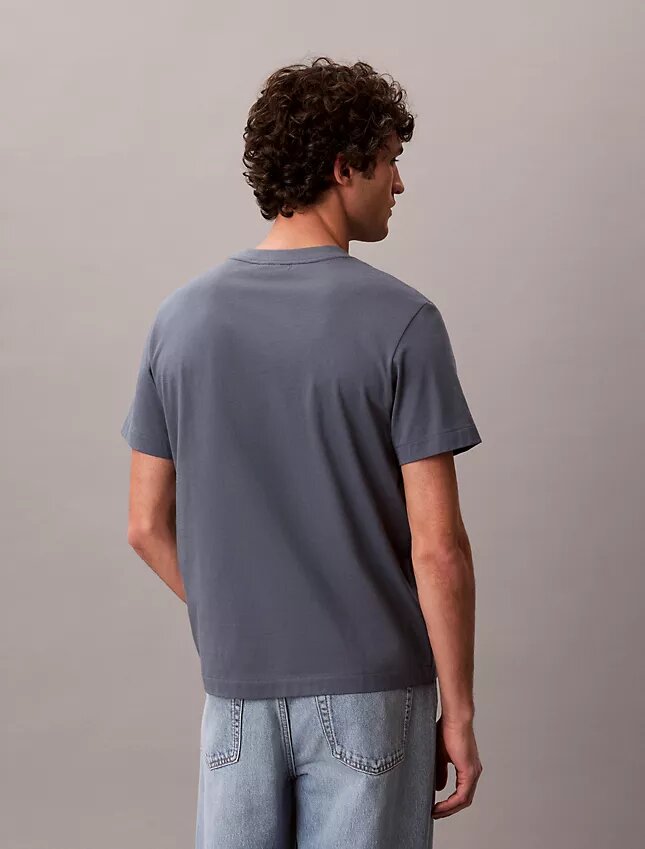Maglietta comoda con tasca in jersey di cotone Maglietta comoda con tasca in jersey di cotone