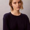 Maglione in cotone a trecce Maglione in cotone a trecce