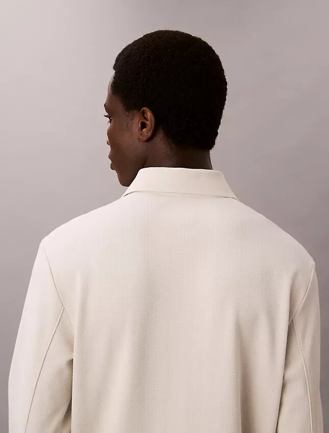 Maglione polo jacquard dal taglio morbido Maglione polo jacquard dal taglio morbido