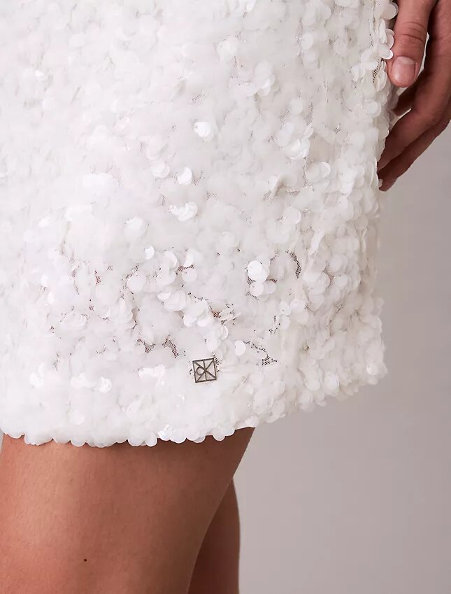 Miniabito con paillettes Miniabito con paillettes