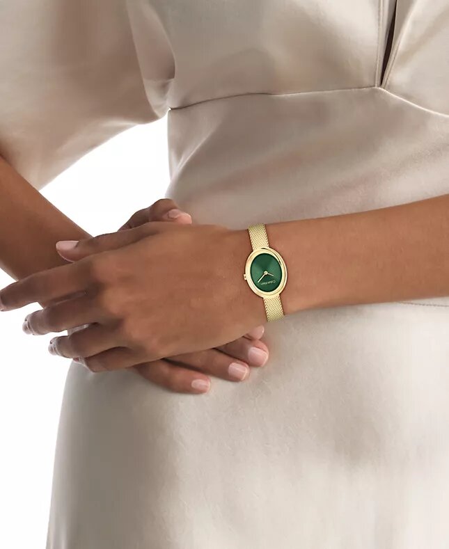 Orologio con lunetta sagomata e quadrante ovale Orologio con lunetta sagomata e quadrante ovale