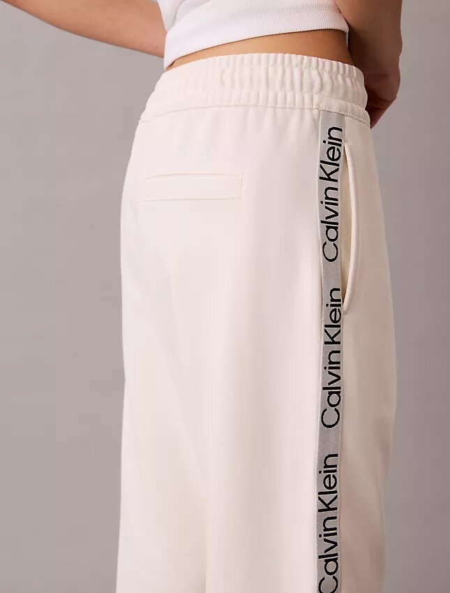 Pantaloni a zampa con nastro con logo Pantaloni a zampa con nastro con logo