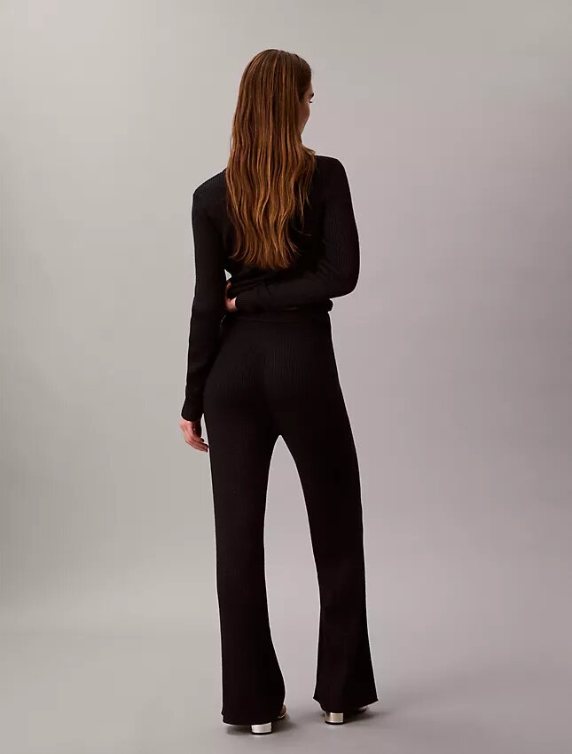 Pantaloni a zampa in misto lana merino e lurex Pantaloni a zampa in misto lana merino e lurex
