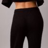 Pantaloni a zampa in misto lana merino e lurex Pantaloni a zampa in misto lana merino e lurex