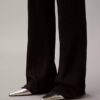 Pantaloni a zampa in misto lana merino e lurex Pantaloni a zampa in misto lana merino e lurex