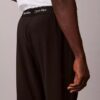 Pantaloni con cintura intrecciata e logo sportivo moderno