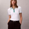 Polo classica con zip a un quarto Polo classica con zip a un quarto