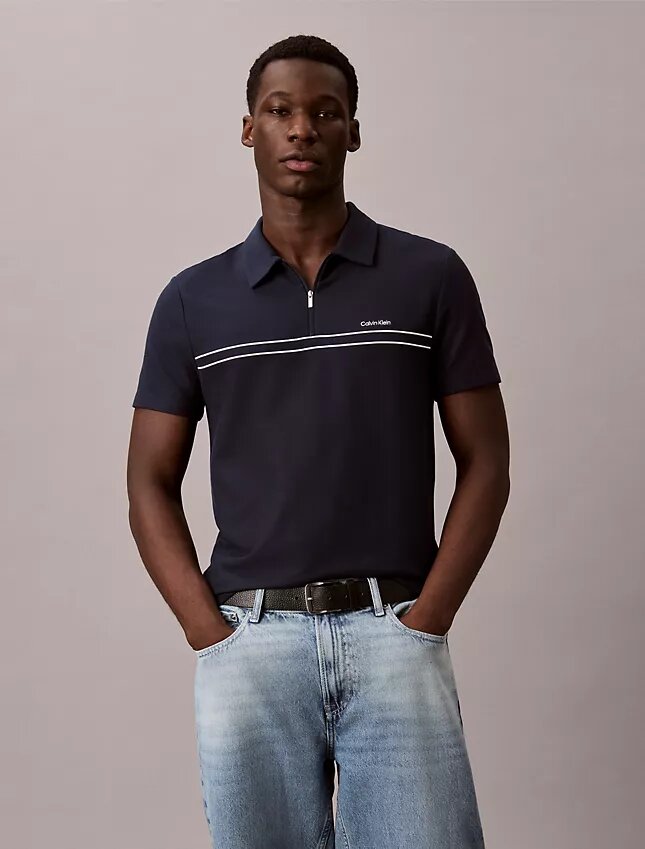 Polo con zip a un quarto e bordino a contrasto Polo con zip a un quarto e bordino a contrasto