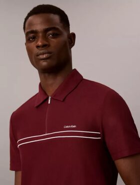 Polo con zip a un quarto e bordino a contrasto