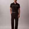 Polo con zip a un quarto e bordino a contrasto Polo con zip a un quarto e bordino a contrasto
