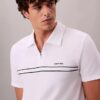 Polo con zip a un quarto e bordino a contrasto Polo con zip a un quarto e bordino a contrasto