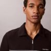 Polo con zip a un quarto e bordino a contrasto Polo con zip a un quarto e bordino a contrasto