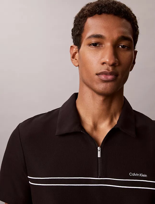Polo con zip a un quarto e bordino a contrasto Polo con zip a un quarto e bordino a contrasto