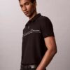 Polo con zip a un quarto e bordino a contrasto Polo con zip a un quarto e bordino a contrasto