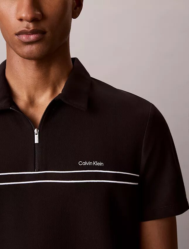 Polo con zip a un quarto e bordino a contrasto Polo con zip a un quarto e bordino a contrasto