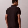 Polo con zip a un quarto e bordino a contrasto Polo con zip a un quarto e bordino a contrasto