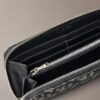 Portafoglio lungo con zip e Monogram su tutta la superficie