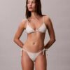 Slip da bikini a tinta unita con lacci laterali per i pantaloni e le gonne Slip da bikini a tinta unita con lacci laterali per i pantaloni e le gonne