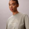 T-shirt squadrata con grafica del logo ad arco T-shirt squadrata con grafica del logo ad arco