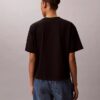 T-shirt squadrata con grafica del logo in stile script sbiadito T-shirt squadrata con grafica del logo in stile script sbiadito