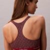 Top bikini a triangolo con dorso a vogatore e logo moderno